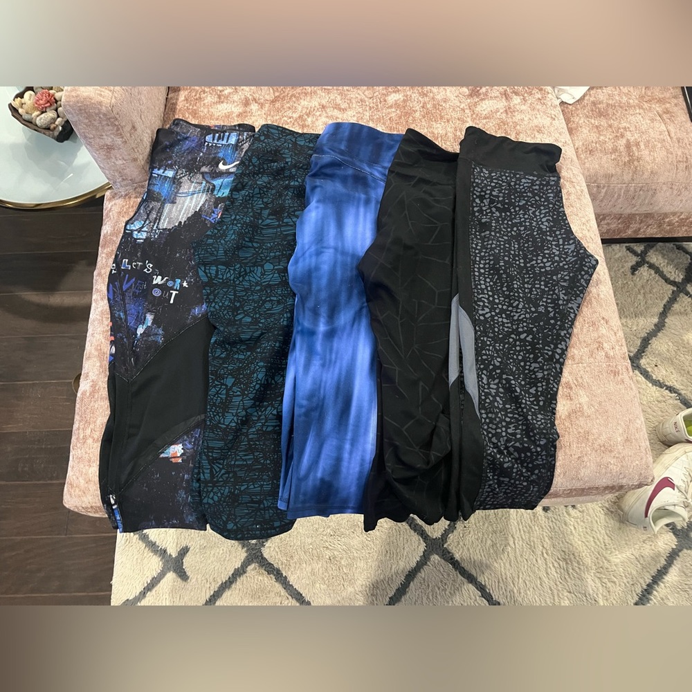 Five pairs of Capri workout pants  size large. Nike, Old Navy, champion.